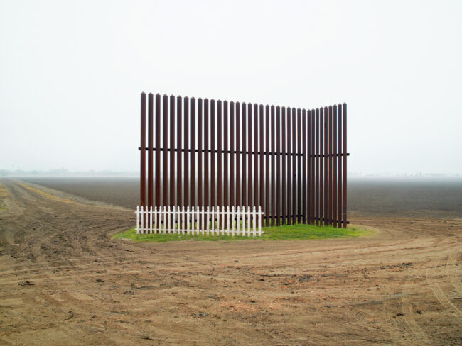 From the "Keep Off My Lawn" series. 2021 by M. Kosturos  A proposal for a friendly and affordable way to plug the holes in the US - Mexico border wall. This one positions the picket fence together with a test segment of the border wall. One of the most beautiful photos made of the border wall, this image was captured by Richard Misrach and can be found in his book Border Cantos, which documents the wall. Misrach's work has inspired me since the late 80's when I began making fine art photography. I appropriate his images with great respect!   This is a work in progress, not the final image. I will release the digital print in an edition of 3.  #keepoffmylawn #buildthewall #marinopenstudios #SFAIalumni   See more of my work on Instagram. https://www.instagram.com/mkosturosartist/