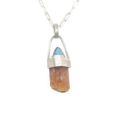 Imperial Topaz Crystal and Blue Apatite Pendant Imperial Topaz Crystal and Blue Apatite Pendant. Classic peachy pink Imperial Topaz with natural crystal faces in a sterling silver pendant. 18” sterling silver chain and clasp included. 1 ½ h x ½ “w.